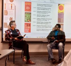 two men facing each other in discussion.